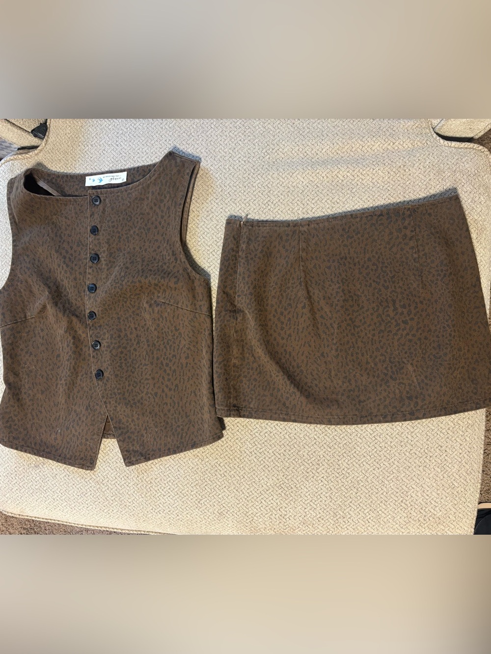 Micro leopard print mini skirt and vest set. Her entire name says grace.